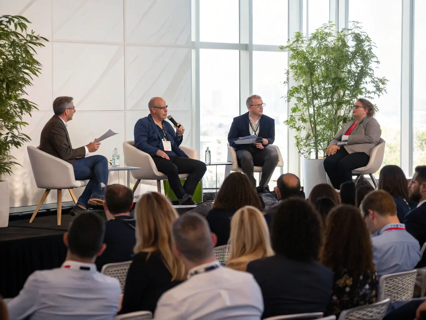 A photograph of a brand storytelling conference in Delhi, India, featuring a panel discussion with leading marketing executives.